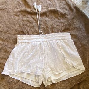 White shorts with silver embellishments. Used.